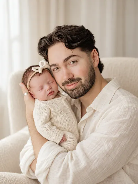 Tender father and newborn in ivory light-1