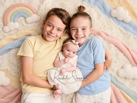 Pastel rainbow sibling portrait with newborn-10